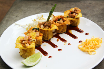 Pad Thai - Thai fusion food - Stir fried rice noodles on white ceramic plate