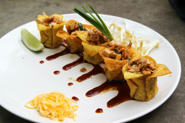 Pad Thai - Thai fusion food - Stir fried rice noodles on white ceramic plate