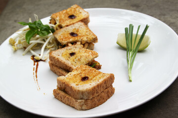 Pad Thai - Thai fusion food - Stir fried rice noodles on white ceramic plate