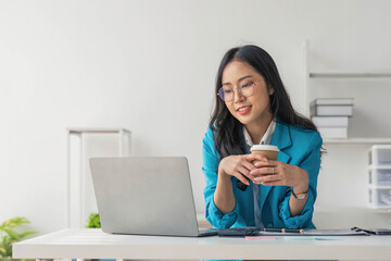 Business woman using calculator for do math finance on wooden desk in office and business working background, tax, accounting, statistics and analytic research concept..