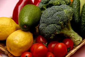 Vegetables in a basket. Wicker basket with assorted raw organic vegetables in the garden.