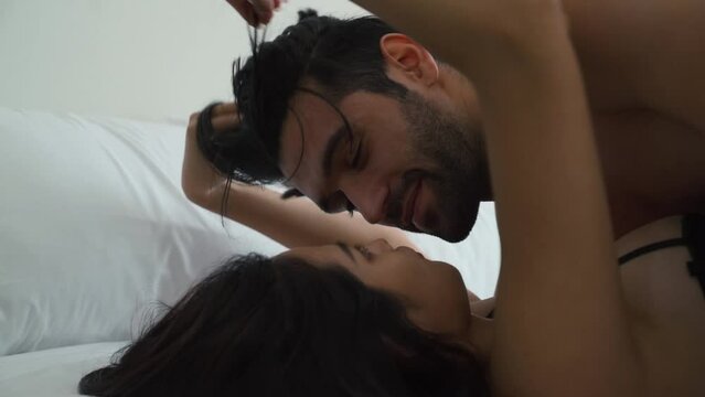 Cinematic slow motion Couple having fun together at home and having sex on the bed in the bedroom at home