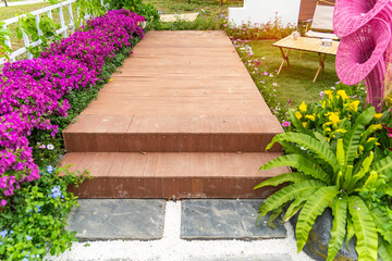 wooden path leading through a garden