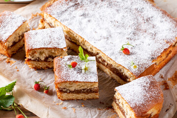 Clasic sponge cake with apples on table, selective focus. Homemade cake