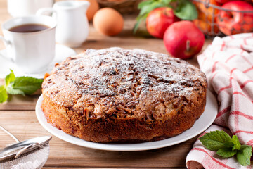 Fototapeta na wymiar Clasic sponge cake with apples on table, selective focus. Homemade cake