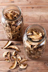 Dried mushrooms. Mushrooms in jar on the wooden table