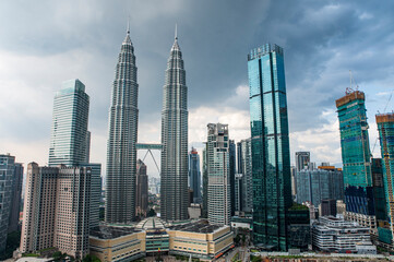 Breath taking view of Petronas twin Towers and Kuala Lumpur skyscrapers view with clouds