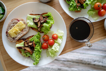 Healthy western breakfast, Sandwich on sourdough bread with cheese, mushroom and vegetable. Picnic breakfast