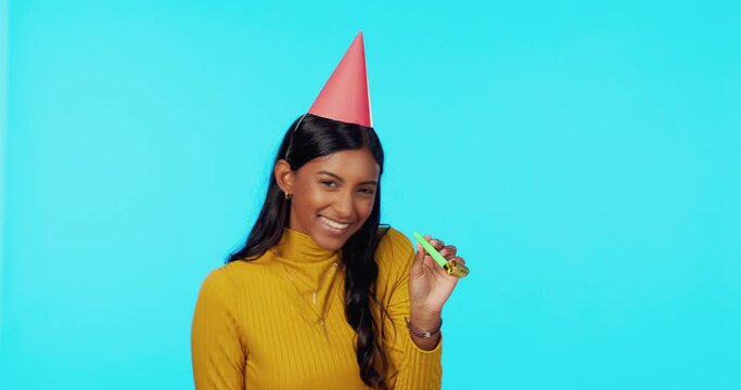 Party, birthday and woman in celebration feeling happy and excited isolated in a blue studio background with a kazoo. Celebrate, mockup and female winner with happiness, freedom and energy