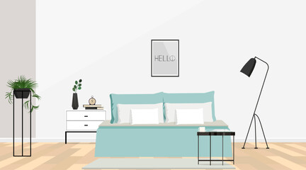 Bedroom interior with white walls, parquet floor, pale sage green bedding and drawer cabinet.