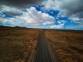 Lonely road on the island of Fuerteventura as seen from a drone