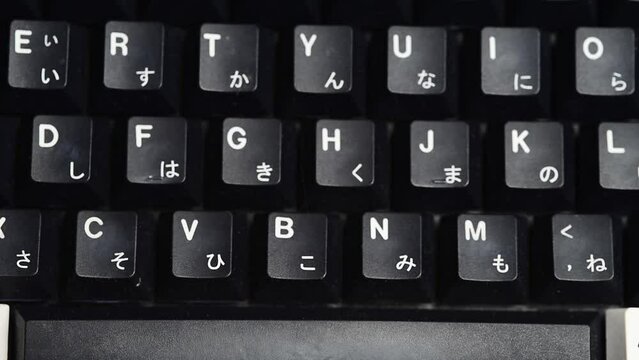 Typing on a mechanical keyboard close up