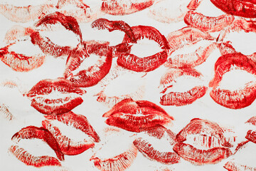 Lip prints of cosmetic lipstick on a light background.