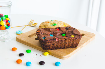 Delicious and colorful cookie and chocolate brownie in a white table