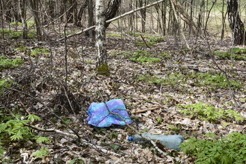 Plastic garbage in the forest.