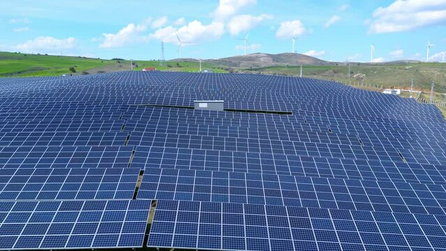 solar energy panels and wind turbine. Drone view 