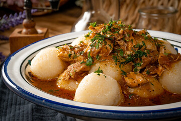 Dumplings with turkey and chorizo sauce.