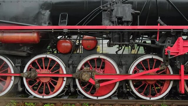 Wheels of the old style steam train locomotive close-up