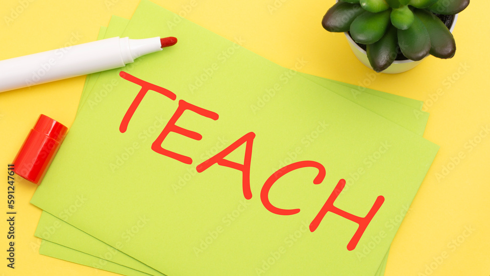 Poster paper with text teach on a yellow background with stationery
