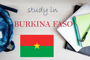 Study in Burkina Faso. Background with notepad, laptop and backpack. Education concept.