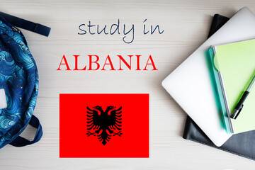 Study in Albania. Background with notepad, laptop and backpack. Education concept.