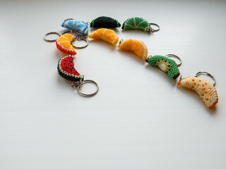A lot of colorful key chains on a white background
