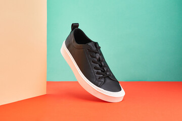 Product photo of sneaker on a colorful background. Men's fashion sport footwear. Interior poster....