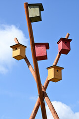 wooden birdhouses of various colors