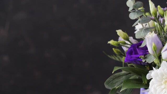 Beautiful composition, bouquet of white and violet roses. Close up. Copy space