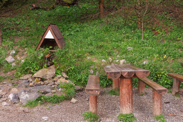 Hearty spring of water in Mala Fatra mountains in front of the chalet under mountain Suchy Vrch.  Drinking water source for tourists