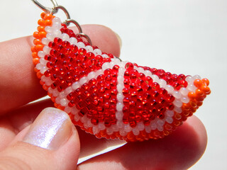 Fruit keychain in a female hand