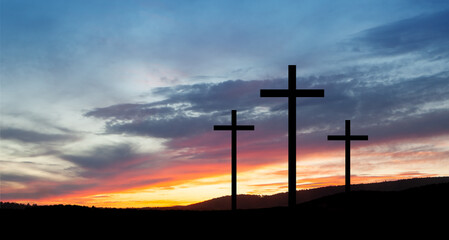 Obraz premium Christian crosses on hill outdoors at sunrise. Resurrection of Jesus.