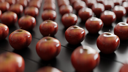 Red shiny apples on a black wooden background, close up