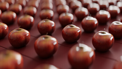 Red shiny apples on a red wooden background, close up