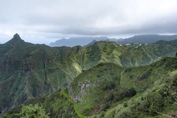 Amazing panorama landscape photo of green natural mountains and hills during winter summer travel in tenerife island, canarias, spain