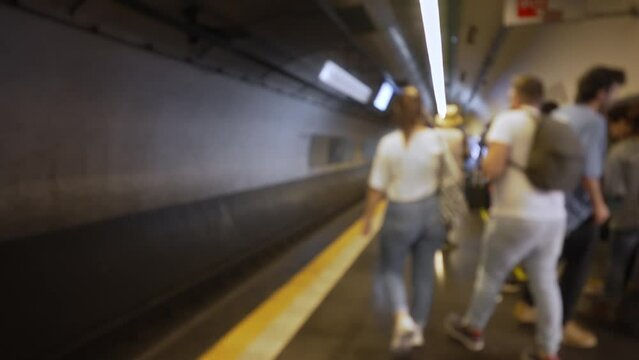Blurred video of subway with people.