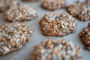 Vegan cookies made of banana and different seeds, photographed with natural light