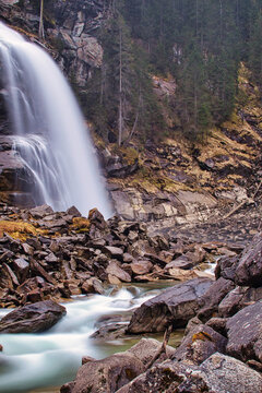 beautiful waterfall with rocks and trees