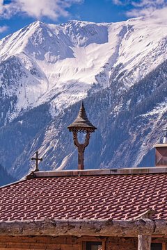 house with alps in background