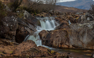 waterfall in the Scottish mountains of Glencoe