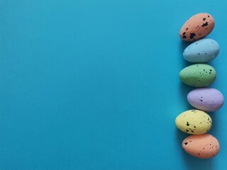 easter, colored eggs on a blue background