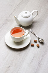 Fototapeta na wymiar Cup of Tea on a light wooden background