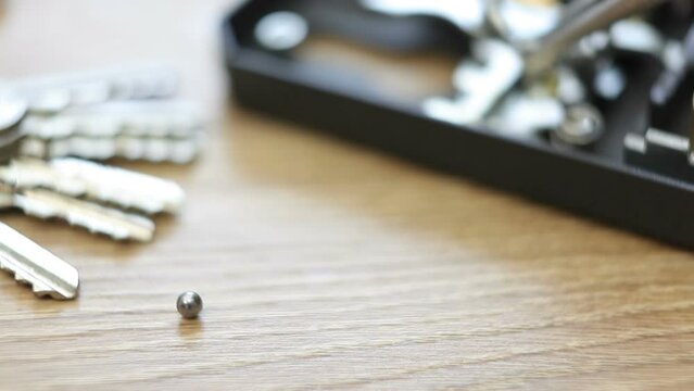 Broken bearing in door lock. Internal lock repair. macro photography.