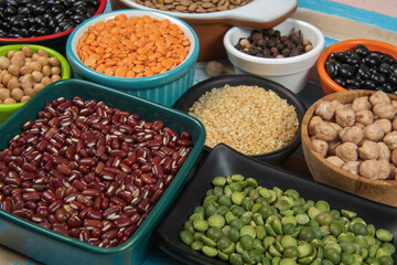 assorted bowls with raw grain and seeds top view