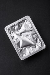 Rectangular plastic box with yogurt or cheese hermetically sealed with a foil lid