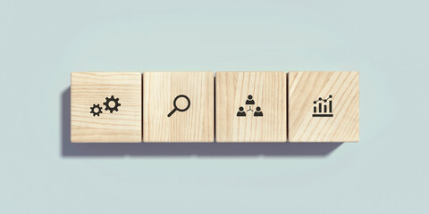 Conceptual business illustration with wooden cubes and icons on light blue background