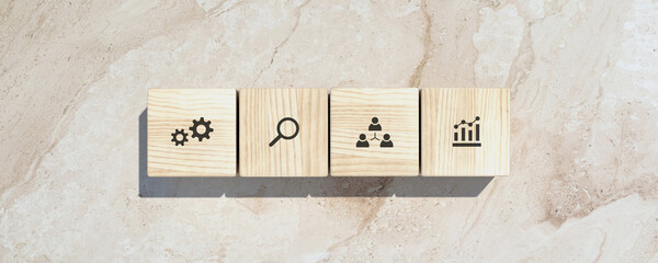 Conceptual business illustration with wooden cubes and icons on marble background