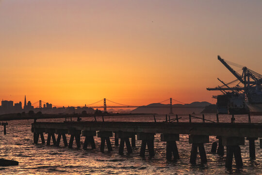 San Francisco Bay, the city and the Bay Bridge at sunset as seen from Alameda Island