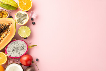 Quench your thirst with tropical flavors. Top flat lay view photo of dragon-fruit, kiwi, papaya, granadilla, carambola, lime, coconut on pastel pink background with copy space for text