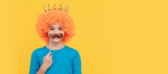 cheerful selfish child girl in curly wig and princess diadem wear party moustache, party. Funny...